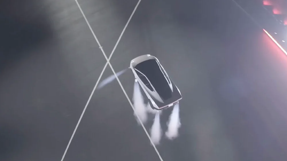Roadster đang bay, tia khí từ các bộ đẩy phía sau hiện rõ. Ảnh: khung hình từ buổi phát trực tiếp Tesla Live ngày 15/10/2026